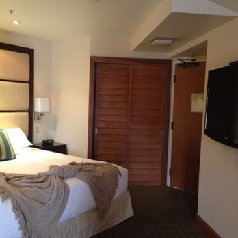 Humphreys Half Moon Inn - The sleeping area in the suite. - San Diego, CA