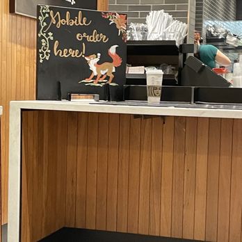 Starbucks - a coffee shop counter with a sign on it - Coffee & Tea Near Me - Port Hueneme, California