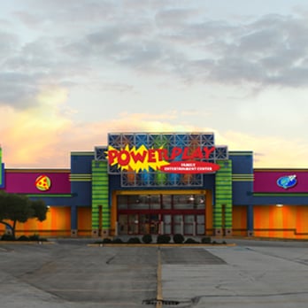 Power Play - an empty parking lot in front of a brightly lit building - Buffets Near Me - Kansas City, Missouri