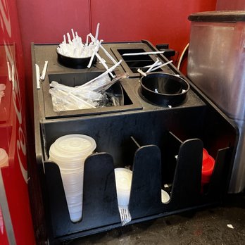 Moe's Southwest Grill - a counter with utensils and cups - Tex-Mex Near Me - Liverpool, New York Moe's Southwest Grill - a counter with utensils and cups - Tex-Mex Near Me - Liverpool, New York