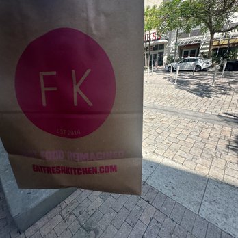 Fresh Kitchen Miami Midtown - a brown paper bag with a pink logo - New American Near Me - Miami, Florida Fresh Kitchen Miami Midtown - a brown paper bag with a pink logo - New American Near Me - Miami, Florida