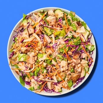 Just Salad - a bowl of salad with chicken, lettuce, and carrots - Salad Near Me - New York, New York Just Salad - a bowl of salad with chicken, lettuce, and carrots - Salad Near Me - New York, New York