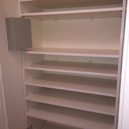 Shoe closet. So clean, and expertly handled the outlets and grey (electrical?) box. Shoe closet. So clean, and expertly handled the outlets and grey (electrical?) box.