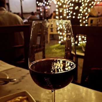 J Theodore - Enjoying some wine and listening to live music - New American Near Me - Frisco, Texas