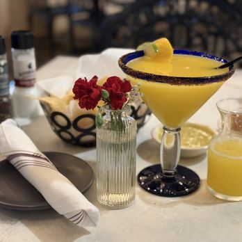 Ambriza - Pineapple Orange frozen margarita, chips and oven roasted salsa and verde sauces. Excellent! - Mexican Near Me - Katy, Texas
