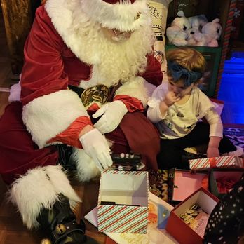 Once Upon An Island - Having fun with Santa and the gift boxes! - Party & Event Planning Near Me - Newport Beach, California