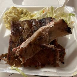 Rib dinner with potato salad and coleslaw. Rib dinner with potato salad and coleslaw.