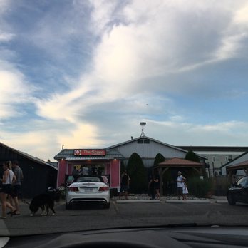 The Scoop - a group of people walking in a parking lot - Ice Cream & Frozen Yogurt Near Me - London, Ontario The Scoop - a group of people walking in a parking lot - Ice Cream & Frozen Yogurt Near Me - London, Ontario