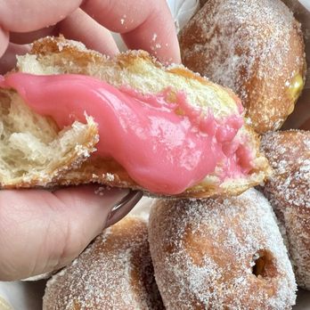 Leonard's Bakery - Guava Malasada Puff. The guava filling oozes out in a sweet, sticky mess. - Bakeries Near Me - Honolulu, Hawaii Leonard's Bakery - Guava Malasada Puff. The guava filling oozes out in a sweet, sticky mess. - Bakeries Near Me - Honolulu, Hawaii