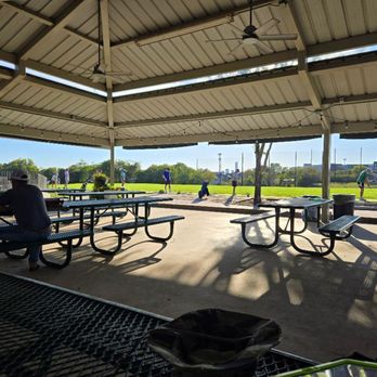 Morris Williams Golf Course - Taking a break between practice buckets on the range. - Golf Near Me - Austin, Texas Morris Williams Golf Course - Taking a break between practice buckets on the range. - Golf Near Me - Austin, Texas