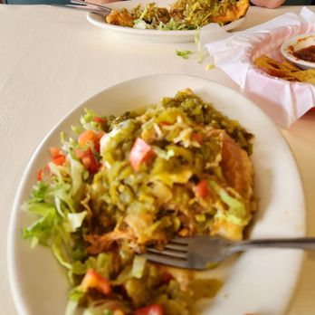 Mary & Tito's - Carne adovada stuffed sopapia covered in green! - New Mexican Cuisine Near Me - Albuquerque, New Mexico
