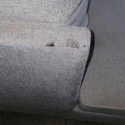 Northeast Factory Direct - The material not only has this oily dirt on it, but also holes in the fabric.