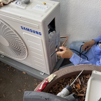 M S Construction - a man fixing a samsung air conditioner - Heating & Air Conditioning/HVAC Near Me M S Construction - a man fixing a samsung air conditioner - Heating & Air Conditioning/HVAC Near Me