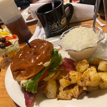 Eggs Up Grill - Egg Bomb BLT with half and half home fries and grits with side of fruit - Breakfast & Brunch Near Me - Alpharetta, Georgia