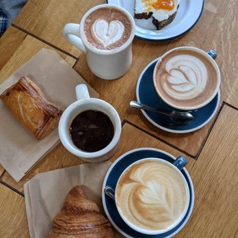The Mill - [Top to bottom] Ricotta toast with seasonal jam, hot chocolate, mocha, guava cheese pastry, americano, latte, butter croissant - Coffee & Tea Near Me - San Francisco, California