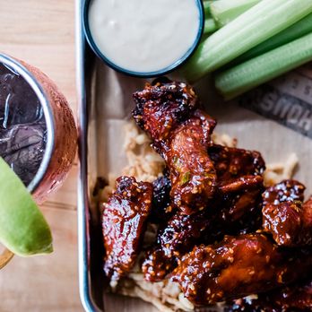 FieldHouse - a plate of chicken wings, carrots, celery, and a drink - Sports Bars Near Me - East Lansing, Michigan FieldHouse - a plate of chicken wings, carrots, celery, and a drink - Sports Bars Near Me - East Lansing, Michigan