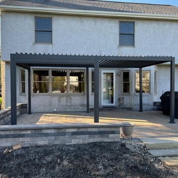 Lorenz Lawn & Landscape - a patio with a pergol roof - Landscaping Near Me Lorenz Lawn & Landscape - a patio with a pergol roof - Landscaping Near Me