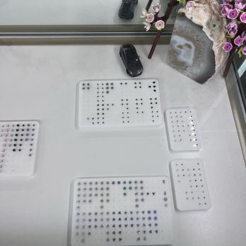 Golden Age Body Piercing - Many choices of earrings. - Piercing Near Me - Los Angeles, California