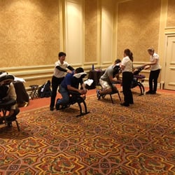 Event Massage Services - Four of our therapists at the Venetian hotel in Las Vegas.