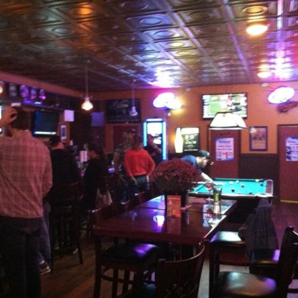 Clipper Mill Lounge - a pool table in the middle of the room - Dive Bars Near Me - Baltimore, Maryland