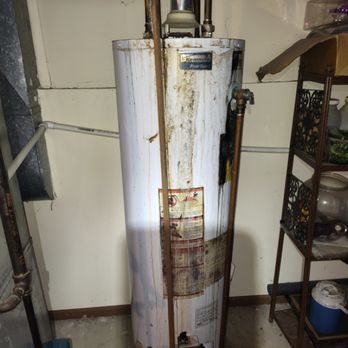 Quick Fix Pro Painting - Old water heater. Gas. - Drywall Installation & Repair Near Me
