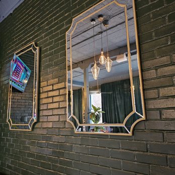 The Wildflower - three mirrors on a brick wall - Cocktail Bars Near Me - Sanford, Florida The Wildflower - three mirrors on a brick wall - Cocktail Bars Near Me - Sanford, Florida