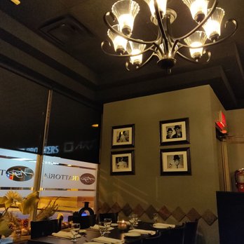 Tigo Trattoria - a dining room with a chandelier - Italian Near Me - Vaughan, Ontario Tigo Trattoria - a dining room with a chandelier - Italian Near Me - Vaughan, Ontario