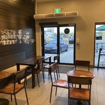 Starbucks - empty tables and chairs in a coffee shop - Coffee & Tea Near Me - Edmonton, Alberta Starbucks - empty tables and chairs in a coffee shop - Coffee & Tea Near Me - Edmonton, Alberta