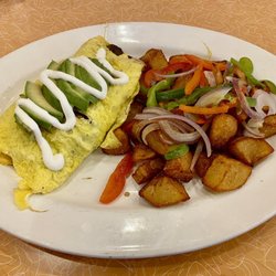 Bacon Avocado Omelet with country potatoes - Really good!