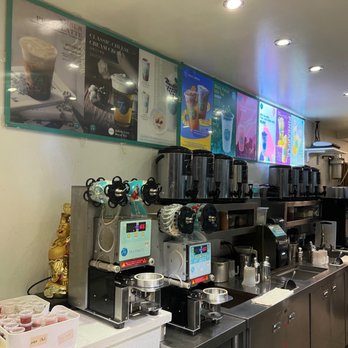 T4 - 11/16/22 Menu - Interior of a cafe or bubble tea shop with coffee machines, beverage dispensers, and menu boards displaying drinks. - Tea Rooms Near Me - San Leandro, California