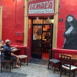 La Mala - My friends and storefront.