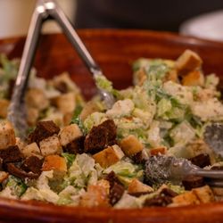 A Taste of Honey - Fresh Caesar salad with crisp romaine, croutons, and parmesan.