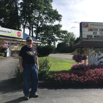 The Sandwich Man - a man standing in front of a sign - Sandwiches Near Me - Calais, Maine The Sandwich Man - a man standing in front of a sign - Sandwiches Near Me - Calais, Maine