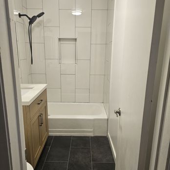 Top Tier Restoration - They installed shower head, shower tile, tile flooring, vanity, toilet - Damage Restoration Near Me Top Tier Restoration - They installed shower head, shower tile, tile flooring, vanity, toilet - Damage Restoration Near Me