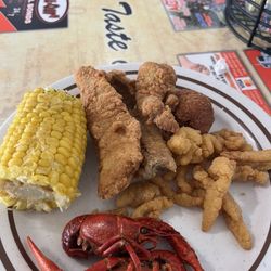 Taste of Dixie Diner - Craw fish, corn on the cob, clam strips, hush puppies, and two different kinds of fried fish