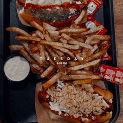 Harrell's Hot Dogs + Cold Cones - Beef hot dogs on brioche buns with a side of fries.
