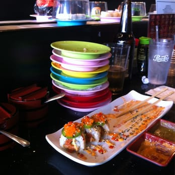 Sushi Moto Bar - Climax special rolls and a stack on empty plates. - Sushi Bars Near Me - Camas, Washington Sushi Moto Bar - Climax special rolls and a stack on empty plates. - Sushi Bars Near Me - Camas, Washington