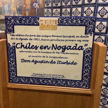 El Mural de los Poblanos - Sign explaining that Chile en Nogada was first served at that very location - Mexican Near Me - Puebla, PUE El Mural de los Poblanos - Sign explaining that Chile en Nogada was first served at that very location - Mexican Near Me - Puebla, PUE