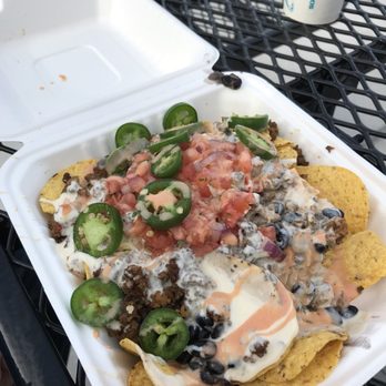 Mojo's Tacos - Nachos with round tortilla chips from a bag, they are the salty kind. - Mexican Near Me - Saint Augustine, Florida