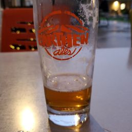 a glass of beer on a table