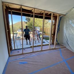 Taking out a wall and installing retractable/folding patio doors
