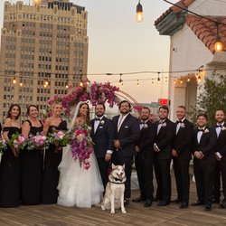 Uptown Flowers - The arch, the bridesmaid/groomsmen flowers...perfection!