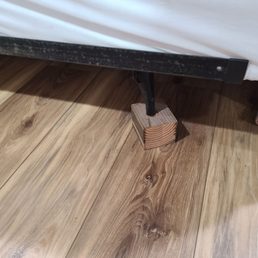 One of the beds was on wood blocks and had no head or foot board.