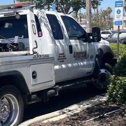 United Towing Services - United towing truck parked in a Total Wine curbside pickup