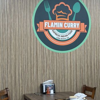 Flamin Curry 2 - One of the tables and the very cute sign at Flamin Curry 2. - Indian Near Me - Long Beach, California Flamin Curry 2 - One of the tables and the very cute sign at Flamin Curry 2. - Indian Near Me - Long Beach, California