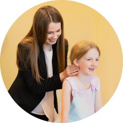 Greensboro Chiropractic - Dr. Dumont palpating a child's neck