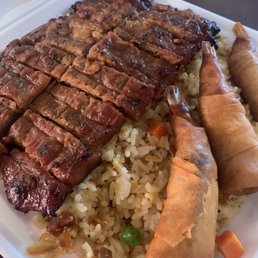 58 Pork and Shrimp Rolls over fried rice 58 Pork and Shrimp Rolls over fried rice