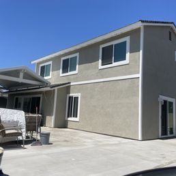 Our freshly painted house, complete with stucco patch and wood trim repair! Our freshly painted house, complete with stucco patch and wood trim repair!