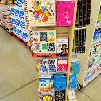 H-E-B - Christian book section - Display shelf in a store with books on religious topics, women, and mental health, including Bibles and self-help titles. - Grocery Near Me - Killeen, Texas