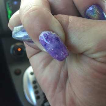 Kim's Nails - Supposed to be covered in foil and the white polish underneath is showing at the cuticle and on the tip. Just got them done last night - Nail Salons Near Me - Austin, Texas